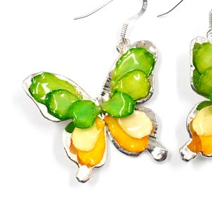 Silver plated Bird's Nest Fern cut into butterfly shape as base is layered with delicate flower Petals in assorted colors in 3D style; preserved in flexible, clear coating. Flower Petal colors can be changed.