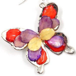 Silver plated Bird's Nest Fern cut into butterfly shape as base is layered with delicate flower Petals in assorted colors in 3D style; preserved in flexible, clear coating. Flower Petal colors can be changed.